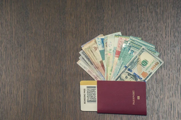 money and passport with ticket, travel and vacation concept