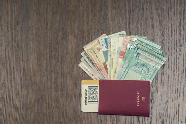 money and passport with ticket, travel and vacation concept