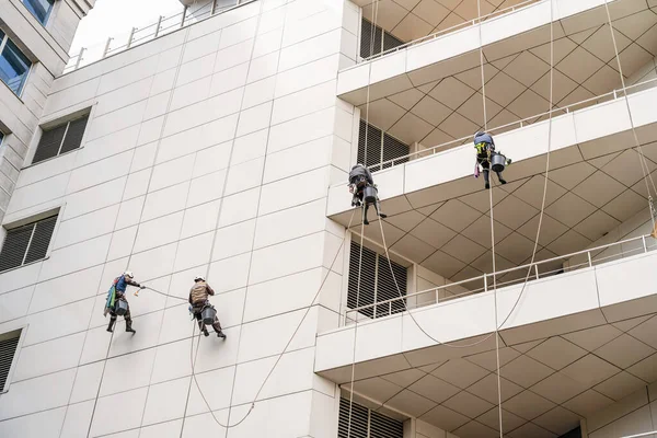 High rise windows and buildings cleaner. Street building disinfection and sanitization due to the emergence of coronavirus or Covid-19.