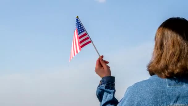 Woman Hand Swaying Multinational Flag Blue Sky Concept — Stock Video