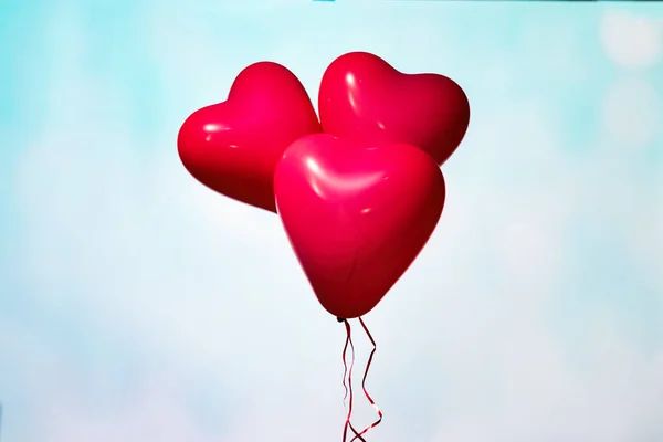 Womans Hand With Heart Shaped Balloon On Background Of Sky Love Concept Old Celebration Stock Photo