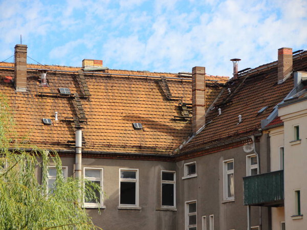 Rooftop Abstract with Secured Chimneys and Red Tiles