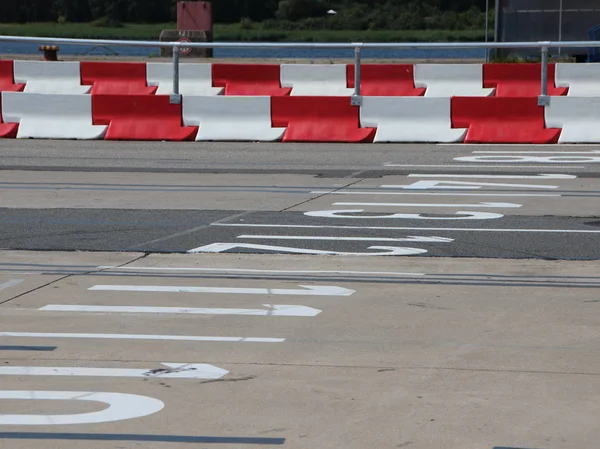 Car Lanes at Ferry Boarding with Striped Strong Crash Barriers — Stock Photo, Image