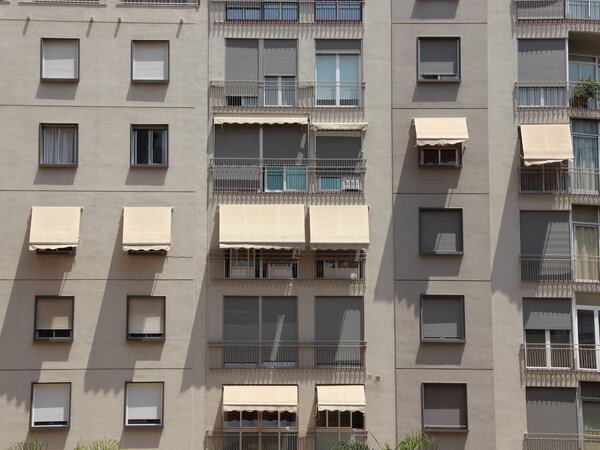 Modern Building Facade with Awning Shade and Windows