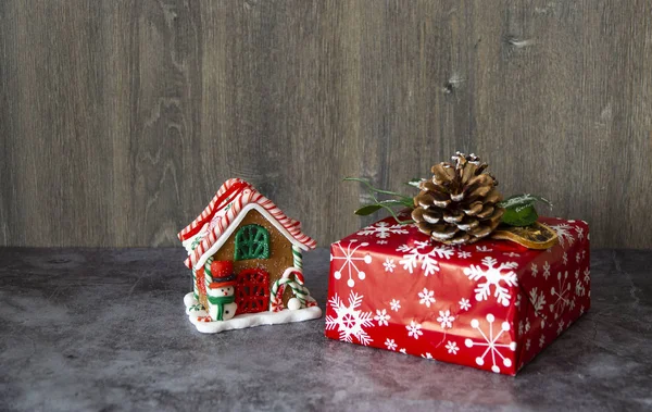 Christmas toys and gift in wrapping paper with Christmas tree cone