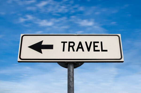 Travel road sign, arrow on blue sky background. One way blank road sign with copy space. Arrow on a pole pointing in one direction.