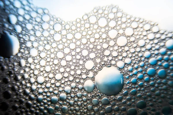 Abstract molecule sctructure. Water bubbles. Macro shot of air or molecule. Abstract blue and white background. Space or planets abstract background. Selective focus
