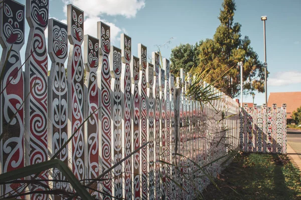 Maori patterns on the fence