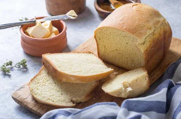 stock image Fresh homemade crisp bread  and slices with olive oil, butter an