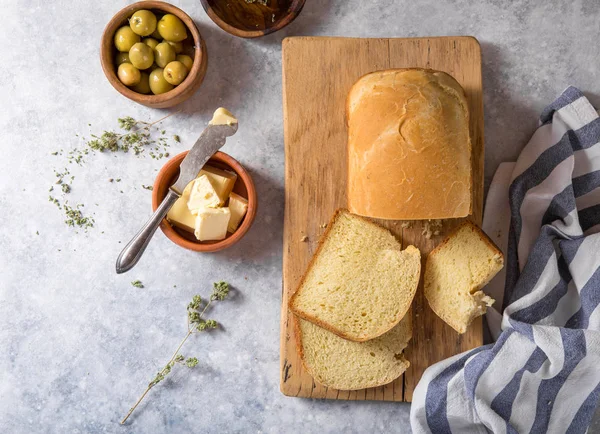 Fresh homemade crisp bread  and slices with olive oil, butter an