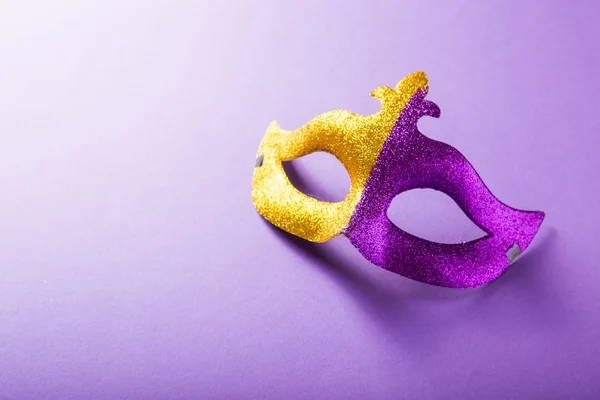 A festive, colorful group of mardi gras or carnivale mask on a p — Stock Photo, Image