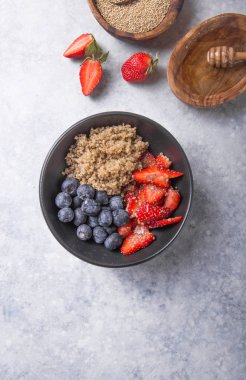 Healthy vegan diet salad quinoa with blueberry,strawberry, honey