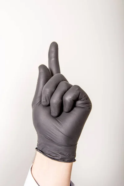 손가락은 흰색에 고립된 상징한다 의학적 장갑으로 — 스톡 사진