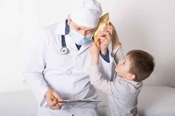 Boy Gives Big Shell Doctor Portrait Smart Pediatrician Little Patient — Stock Photo, Image