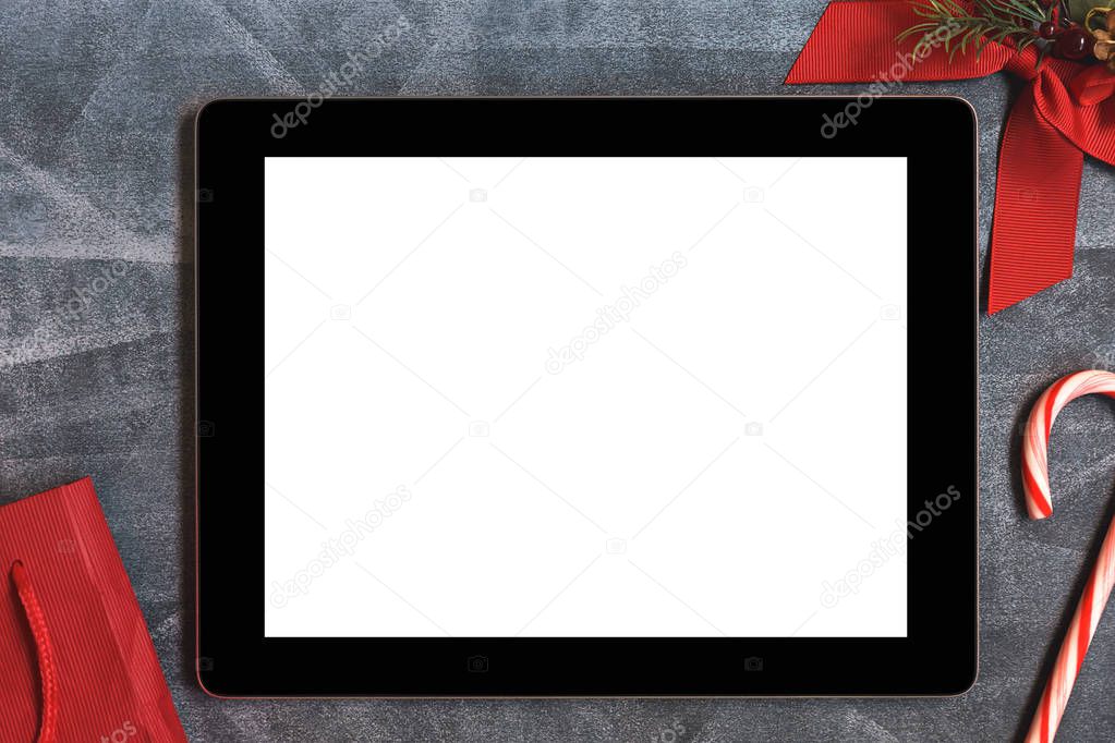 Digital tablet with white blank empty screen and Christmas decoration
