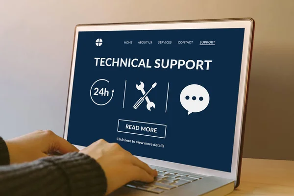 Technical support concept on laptop computer screen on wooden table