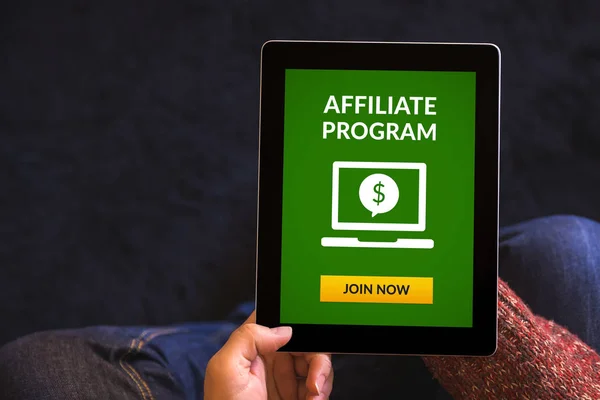 Hands holding tablet with affiliate program concept on screen — Stock Photo, Image
