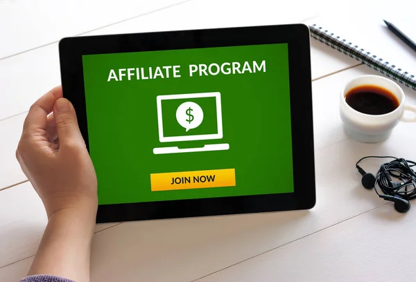 Hand holding tablet with affiliate program concept on screen — Stock Photo, Image