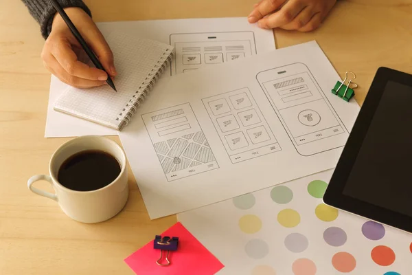 Designer drawing mobile App wireframes — Stock Photo, Image