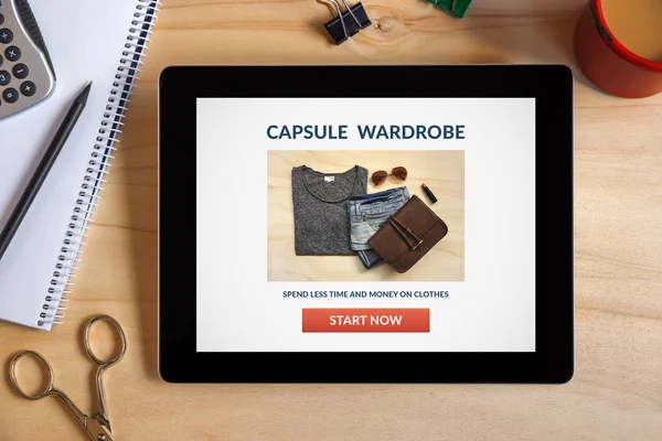 Capsule wardrobe concept on tablet screen with office objects — Stock Photo, Image