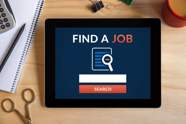 Find a job concept on tablet screen with office objects — Stock Photo, Image