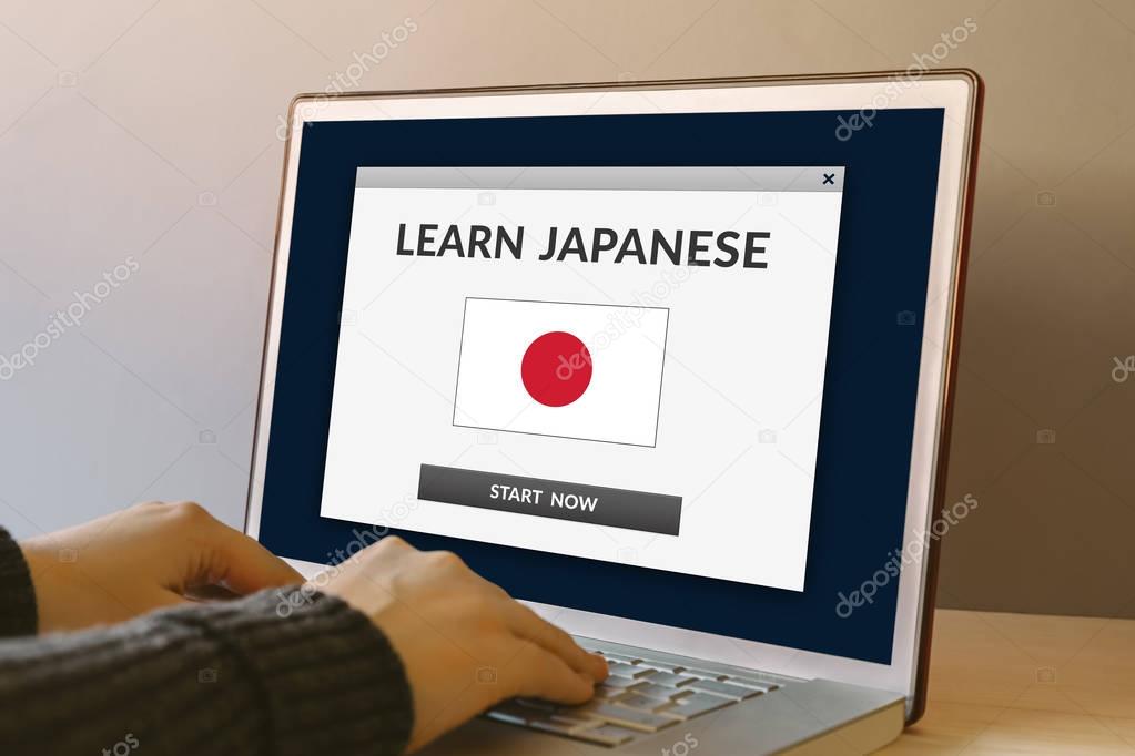 Learn Japanese concept on laptop computer screen on wooden table