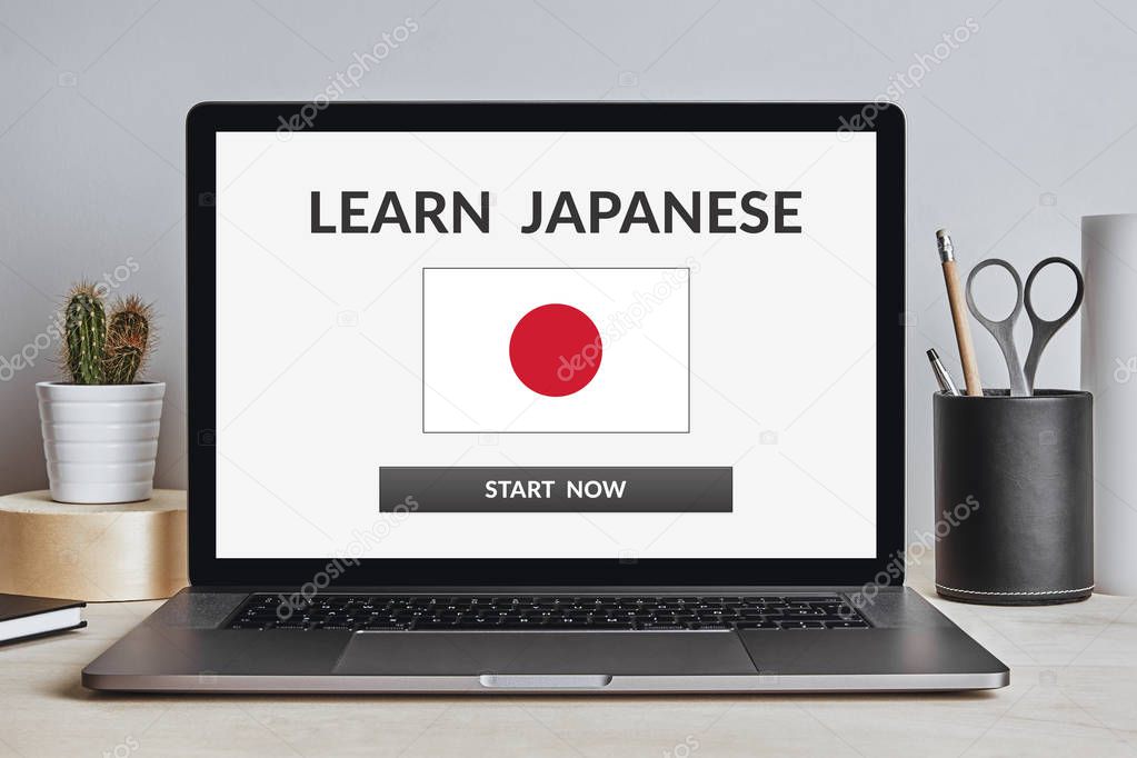 Learn Japanese concept on laptop screen on modern desk