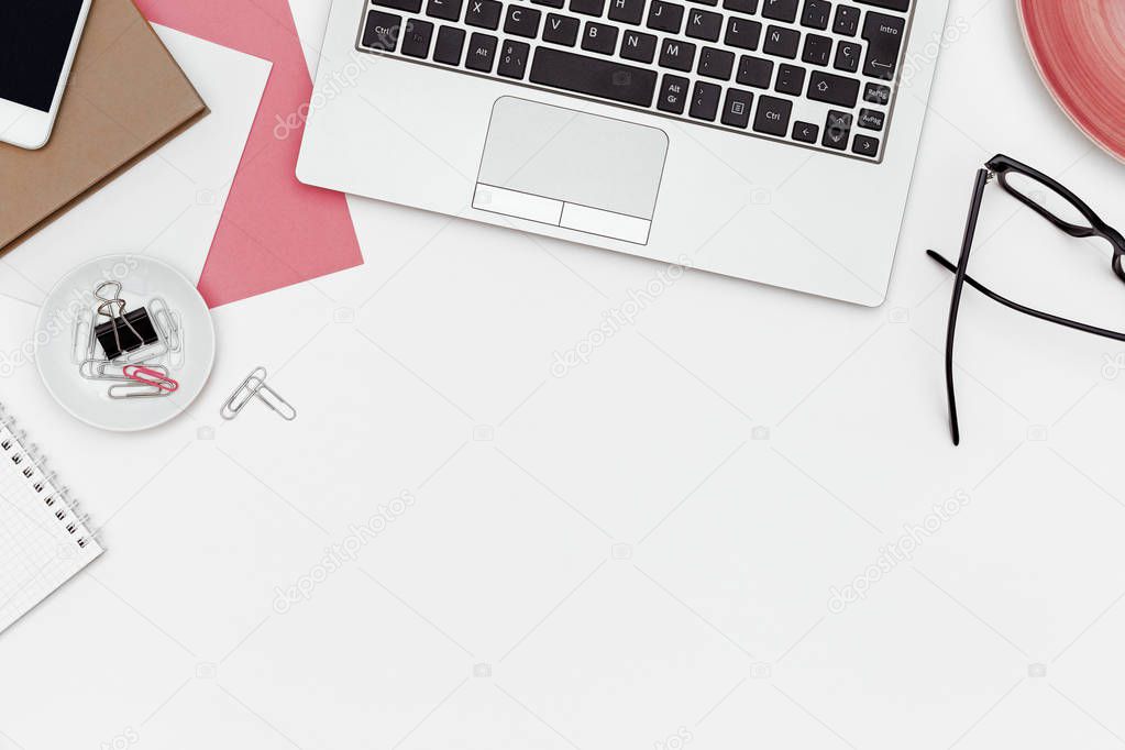 Feminine business desk with copy space on white background