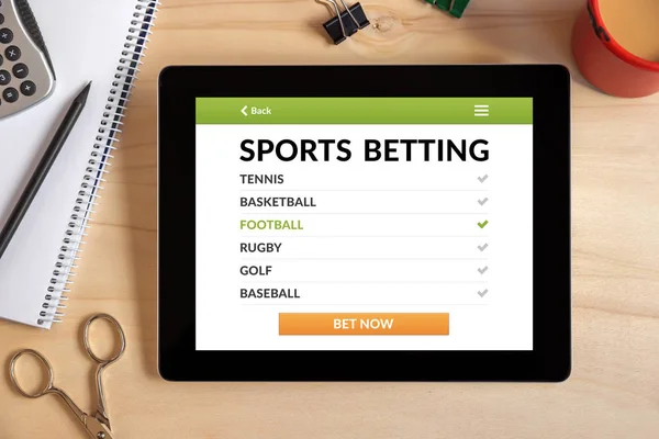 Sports betting concept on tablet screen with office objects — Stock Photo, Image