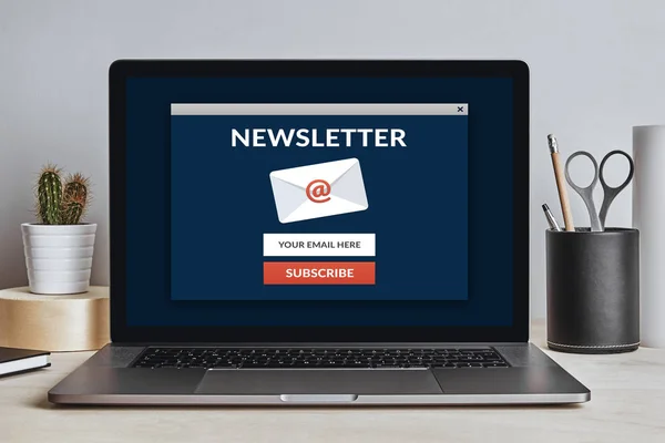 Subscribe newsletter concept on laptop screen on modern desk