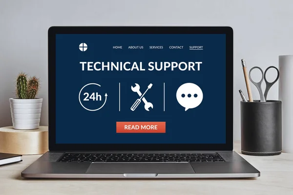 Technical support concept on laptop screen on desk