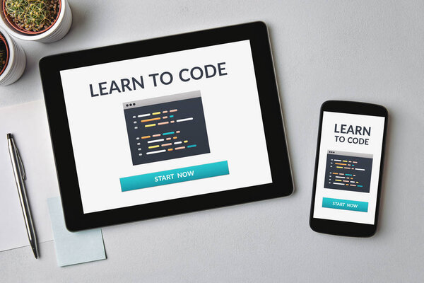 Learn to code concept on tablet and smartphone screen