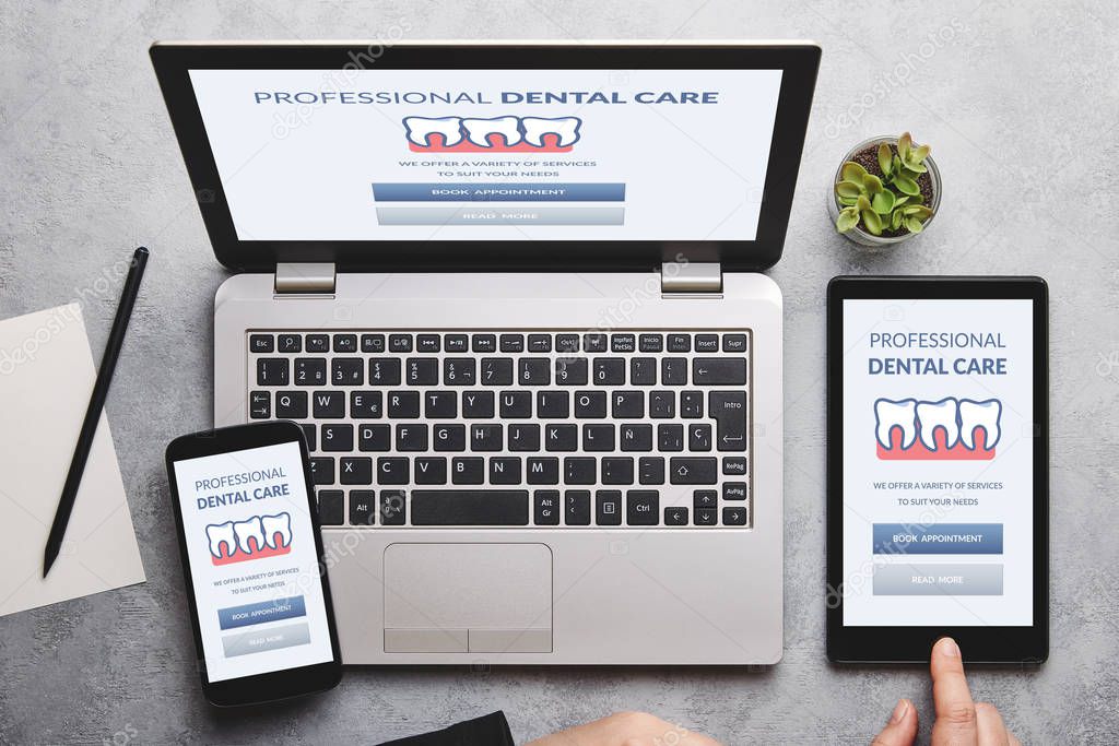 Dental care concept on laptop, tablet and smartphone screen
