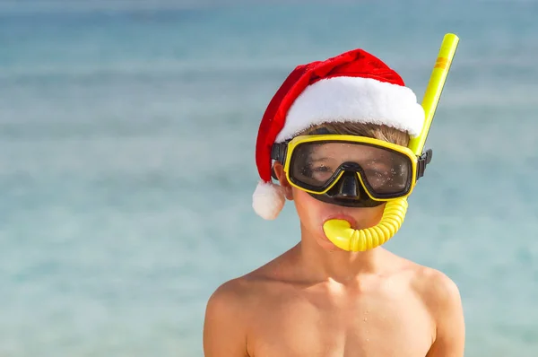 stock image Beach vacation fun boy wearing a snorkel scuba maskand santa claus hat