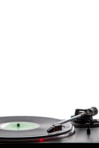 Record player with vinyl record and white copy space