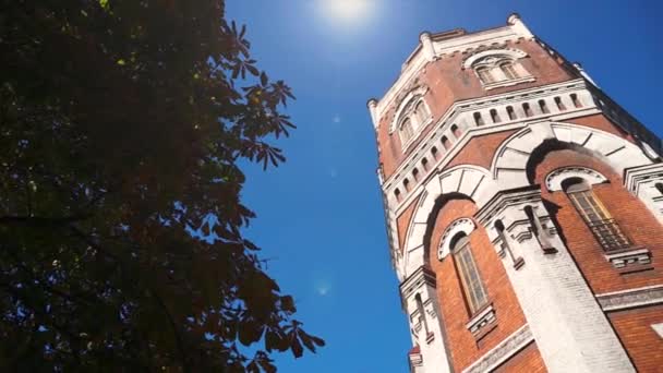 Old building, tower over blue sky — Stock Video
