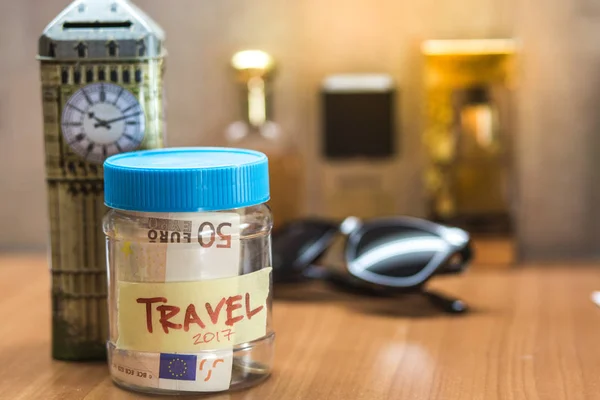 Travel budget concept. Travel money savings in a glass jar — Stock Photo, Image