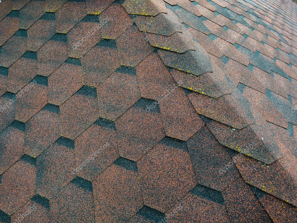 Roof with aged asphalt tiles — Stock Photo © PEPPERSMINT #153464784