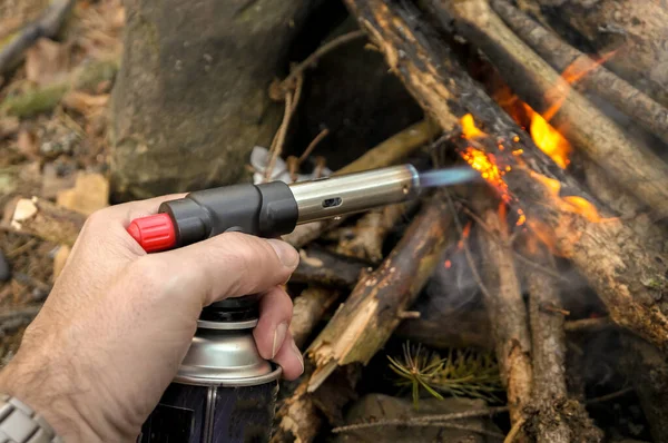 Man Butane Can Burner Kindles Fire Bonfire Forest — Stock Photo, Image