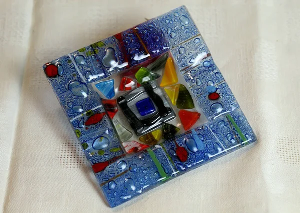 stock image Frames on the table for photos and paintings with colored red, blue, white round glasses and an Apple on the tablecloth