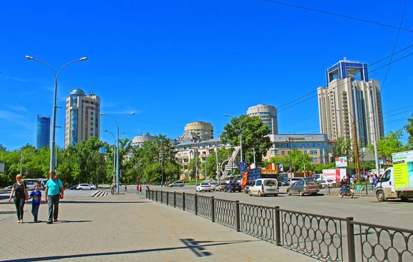 Urban development and pond panorama of high-rise administrative, religious, spectacular, sports and residential buildings, fountains and trees