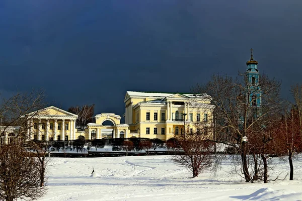 Urban development of different types of structures, public, administrative, residential and religious, in the afternoon and in the morning with the rising sun and clouds, in the evening with lighting and snowfall ,