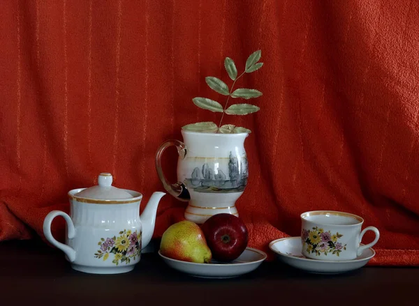 Interior items for still life: clock, fruit, wine glasses, tea set, jug, candle, computer, bottle and easel