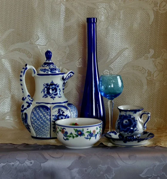 Interior items for still life: clock, fruit, wine glasses, tea set, jug, candle, computer, bottle and easel