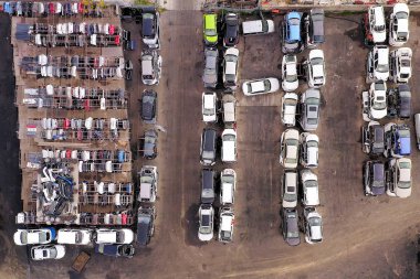 Salvaged Car Doors section at a Large Car parts and Vehicles lot, Aerial view.