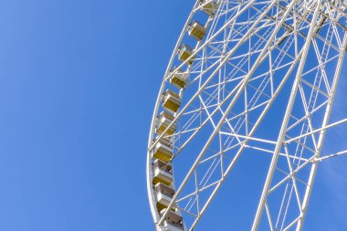Big wheel with blue sky in the background
