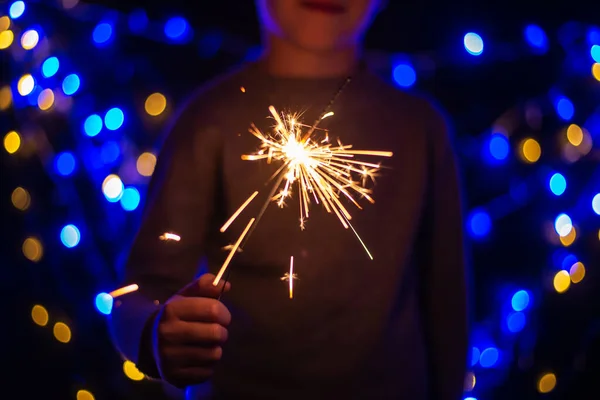 Festive Christmas Background Child Holding Burning Sparkler Cropped Shot — Stock Photo, Image
