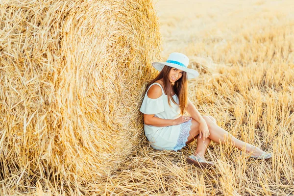 Beautiful Young Woman White Dress Hat Sitting Hay Bale Smiling — Stock Photo, Image