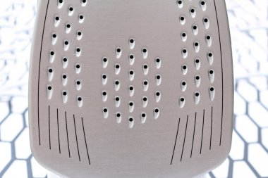 close-up view of shiny modern electric iron indoors