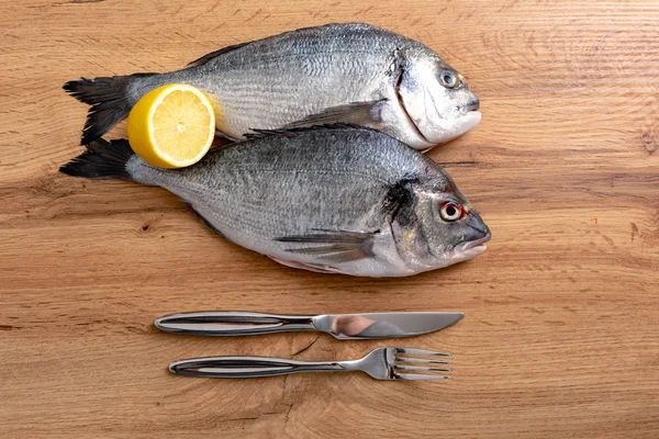 Top View Fresh Raw Fish Lemon Slice Fork Knife Wood — Stok Foto